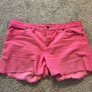 Super cute but too small for me now :(.  The color is coral pink. Great brand